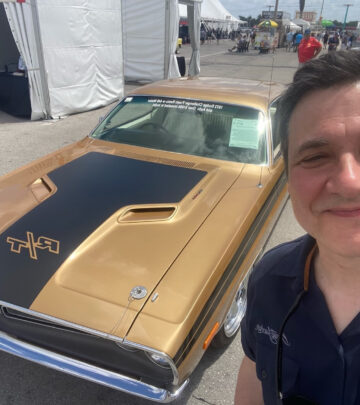 Comedian and car enthusiast connects with automotive personalities at prestigious auction event