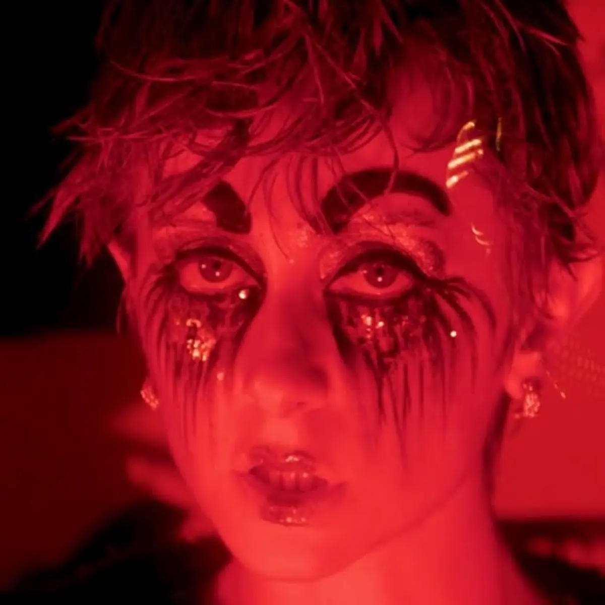 Former Disney star showcases musical talent with collaborators in visually stunning production.