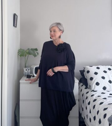 Fashion influencer demonstrates versatile styling approach that extends seasonal wear of dresses