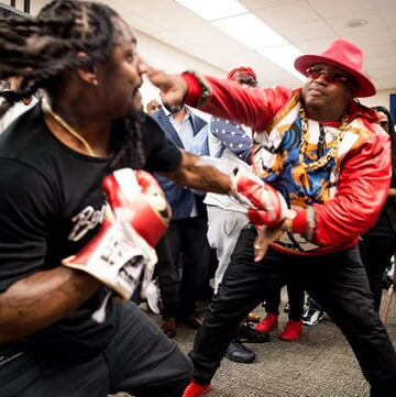 Rap icon reveals playful sparring session with 'Beast Mode' while celebrating football legend.