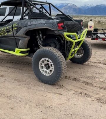 Stone Cold Steve Austin revs his 2021 Kawasaki KRX1000 for a rainwashed ride of raw thrill