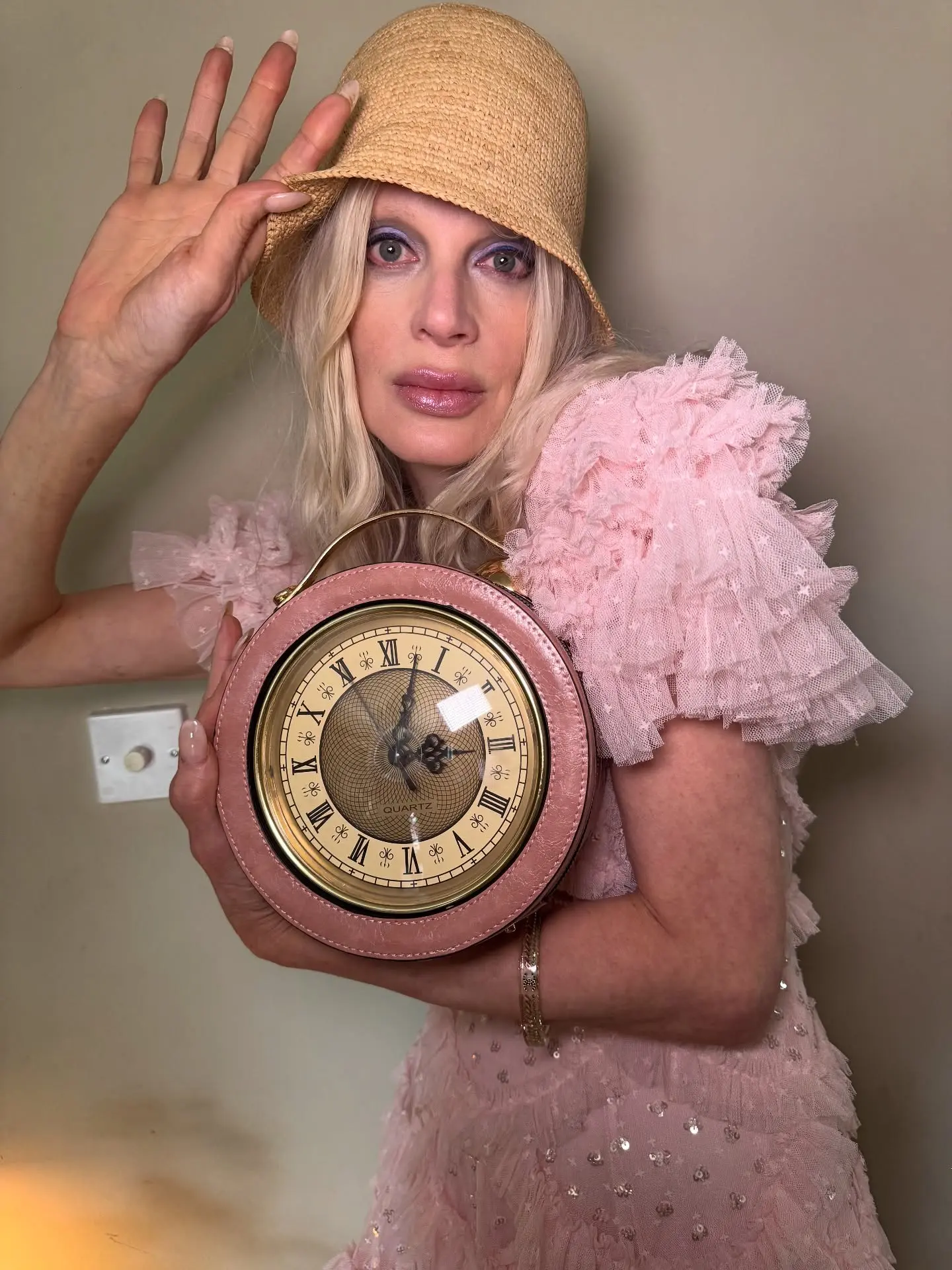 Fashion icon's minimalist Instagram update sparks curiosity among followers and style watchers.