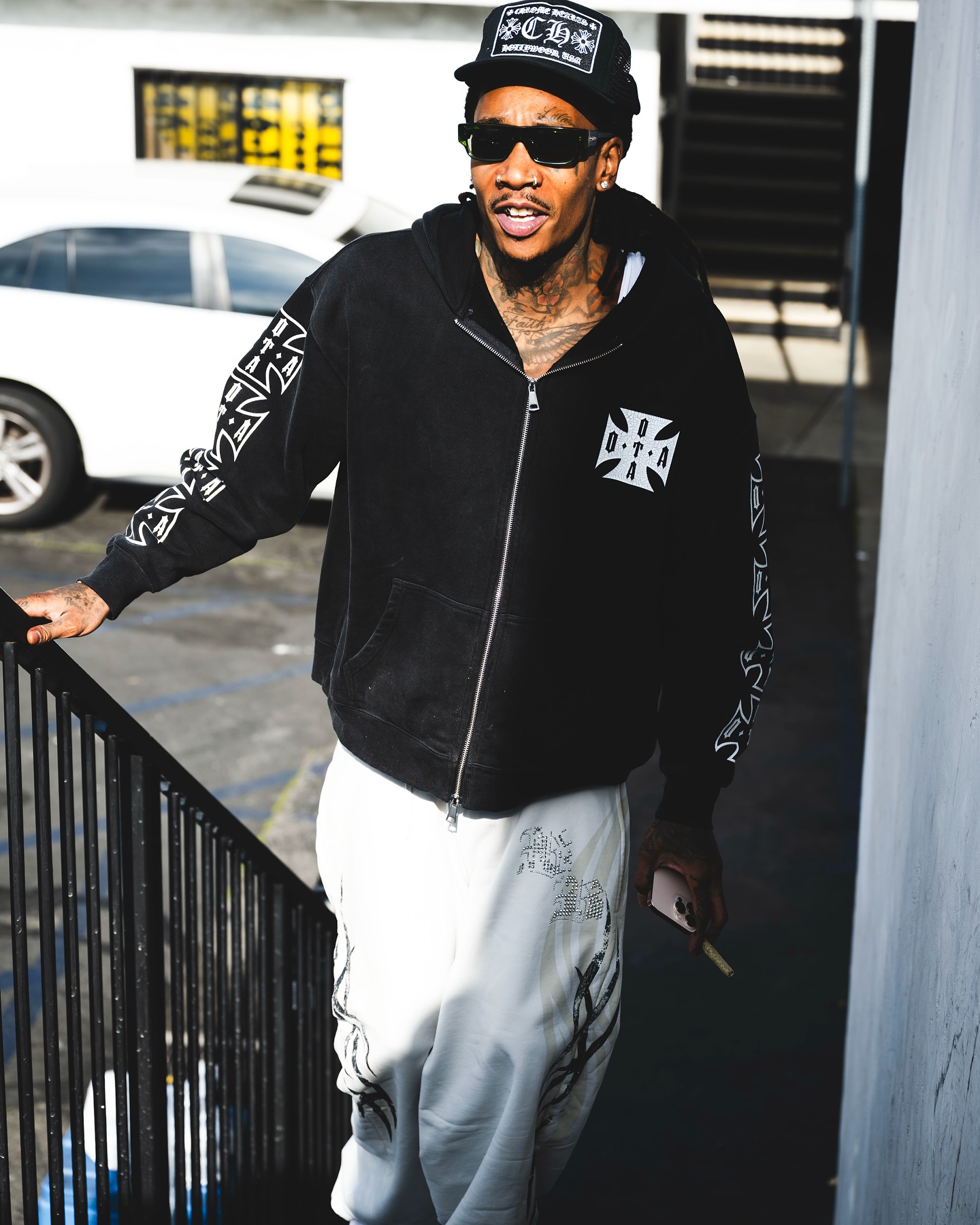 Rapper shares intimate studio moments in photo carousel celebrating creative partnership.