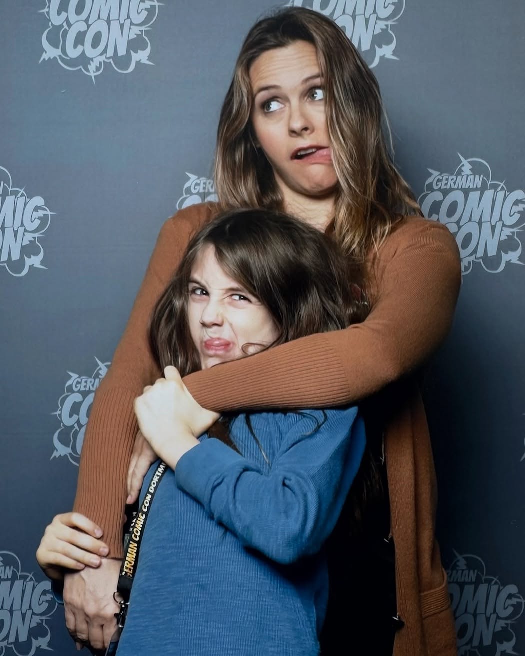 Alicia Silverstone Throws It Back With Superhero Sidekick at Comic-Con