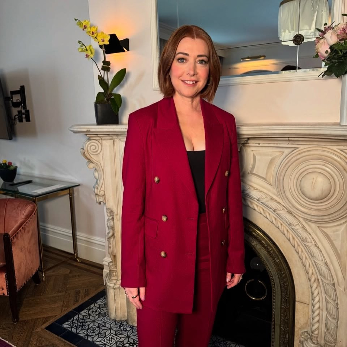 Alyson Hannigan Stuns In Sunnydale-Inspired Look Sunnydale vibes spark as Hannigan dons tailored suit with chic jewelry and designer shoes.