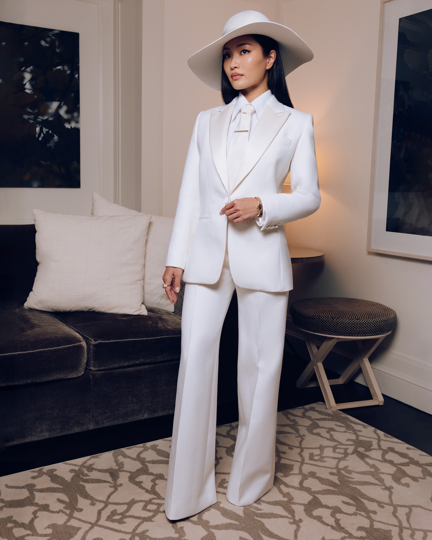 Dior custom suit, statement hat, and impeccable styling mark her debut on the red carpet!