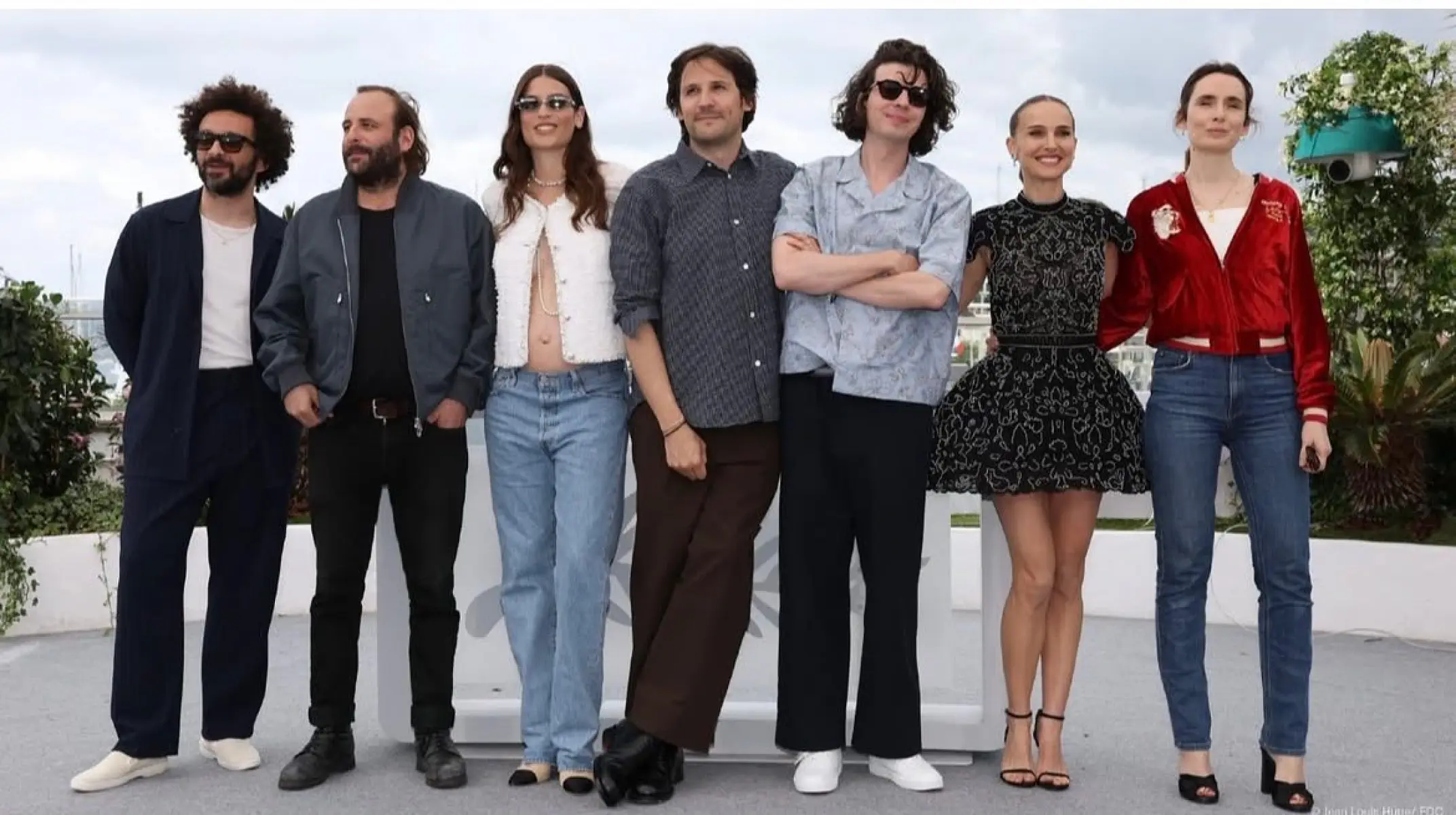 Dynamic outdoor photocall at Cannes featuring creative talent, memorable moments captured!