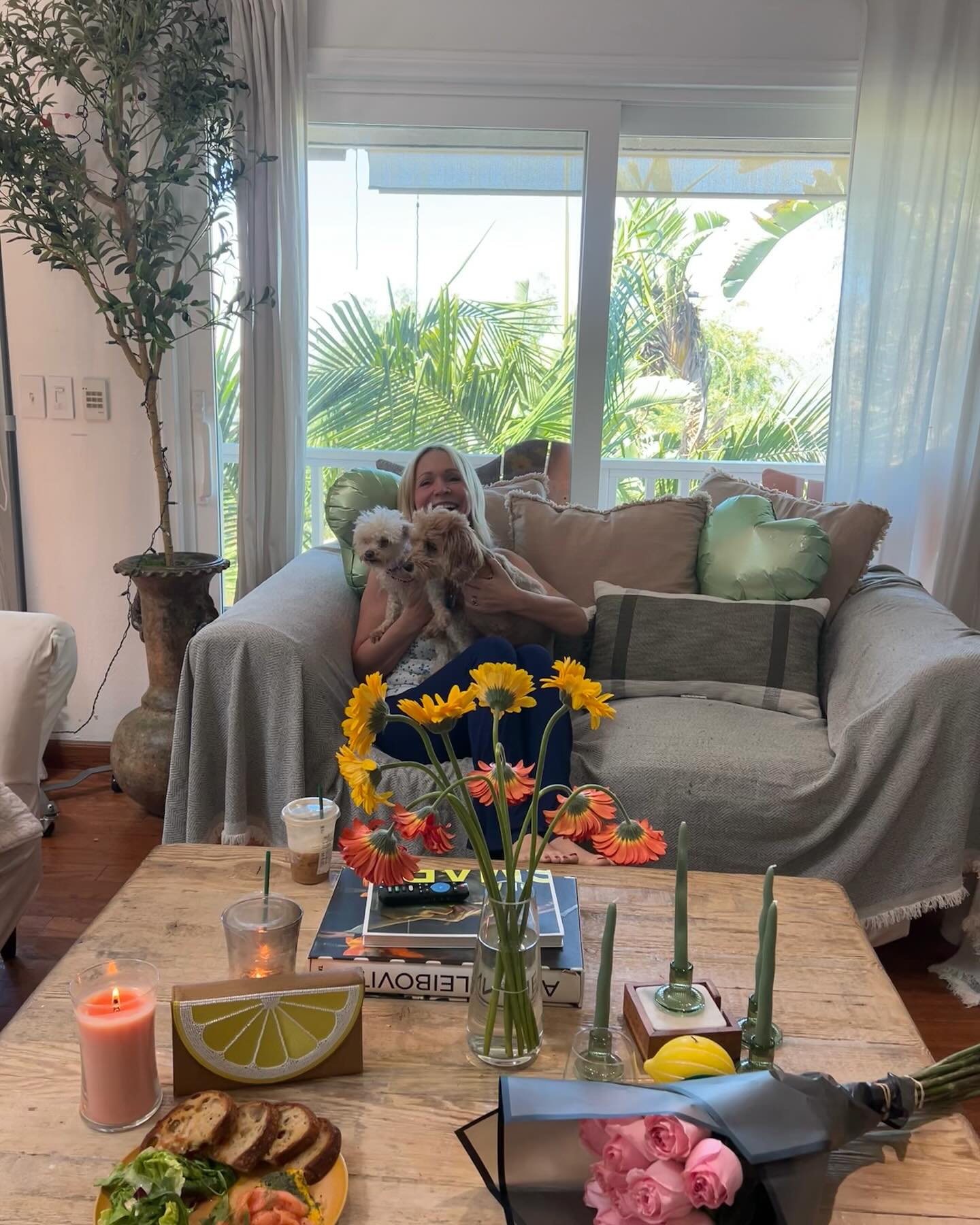 Barbara Alyn Woods Celebrates Perfect Mom Day Barbara shares joy with daughters, elderly friends, pups, coffee and chic new pillow vibes.