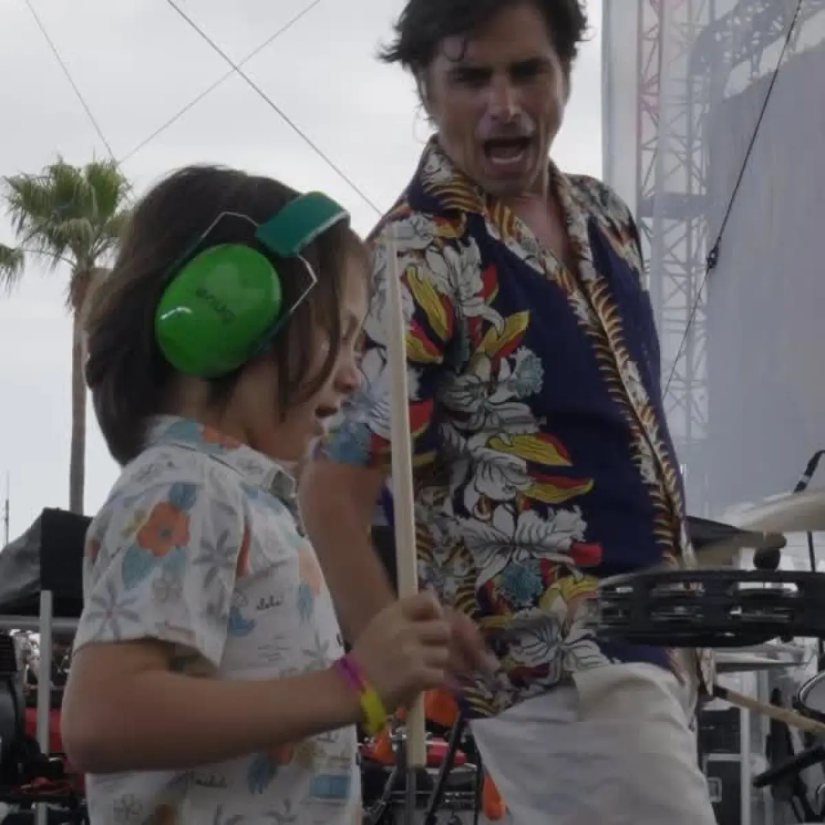 Redondo Beach sizzles with Beach Boys, featuring John Stamos and vivid festival vibes truly.