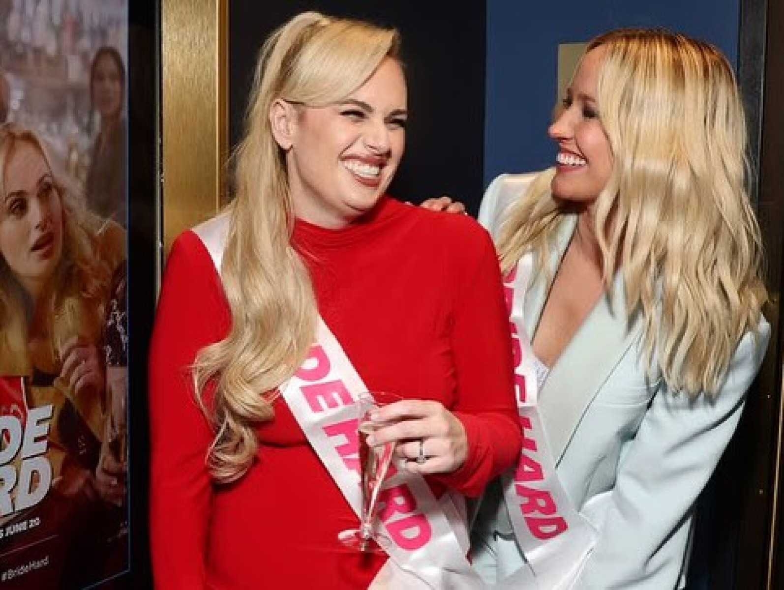 Bride Hard Movie Celebration Sparks Cinema Night Anna Camp and Rebel Wilson celebrate at a cinema stunt for new Bride Hard release.