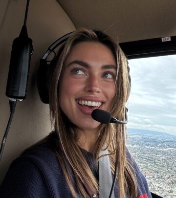 Captain Charlie Speaks With Urban Aerial View
