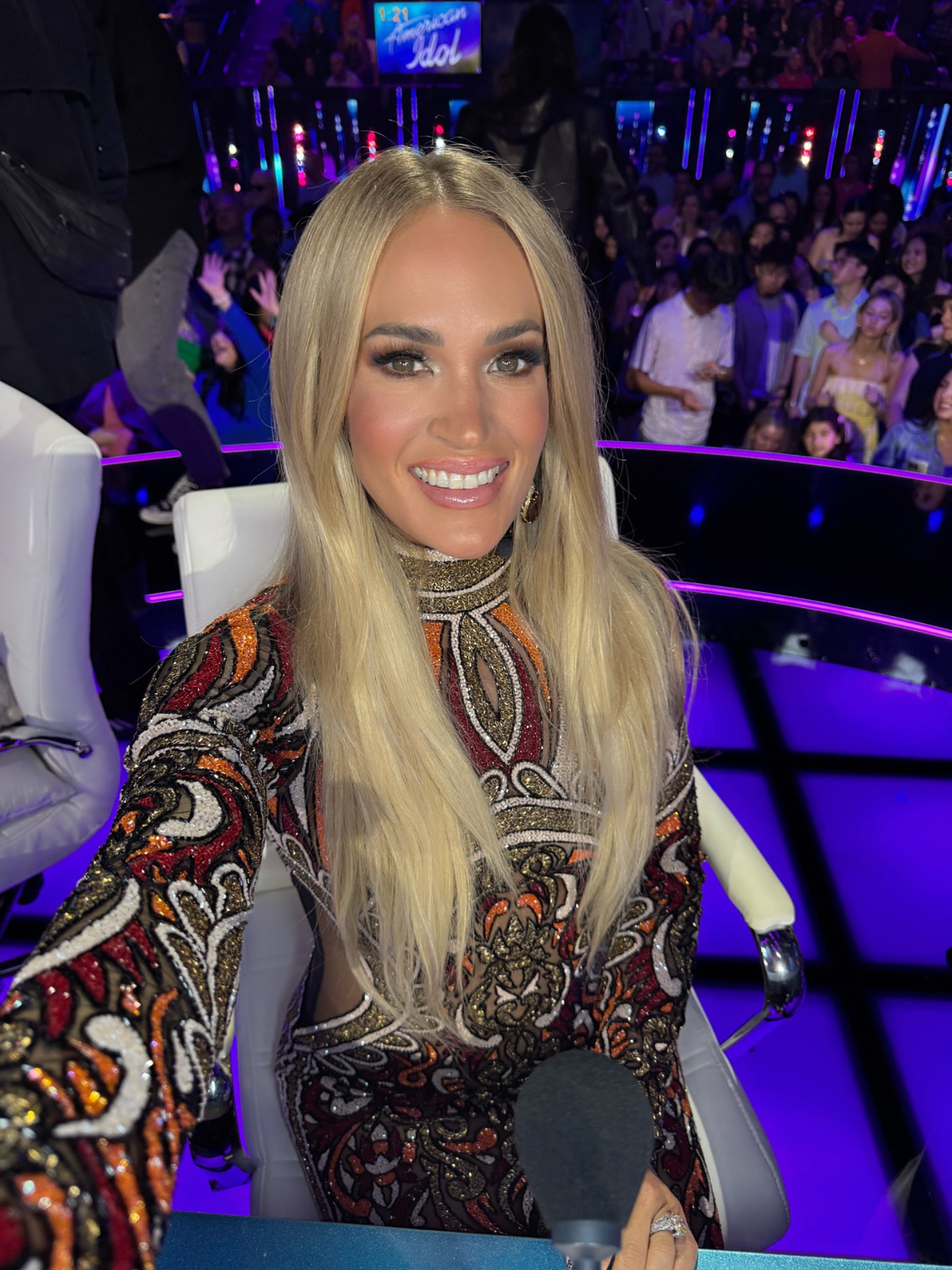 Carrie Underwood ignites Idol night, embracing raw moments with vibrant energy and flair.