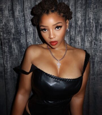 Chloe Bailey stuns with red lips and chic bantu knots, elevating her style to pure glamour