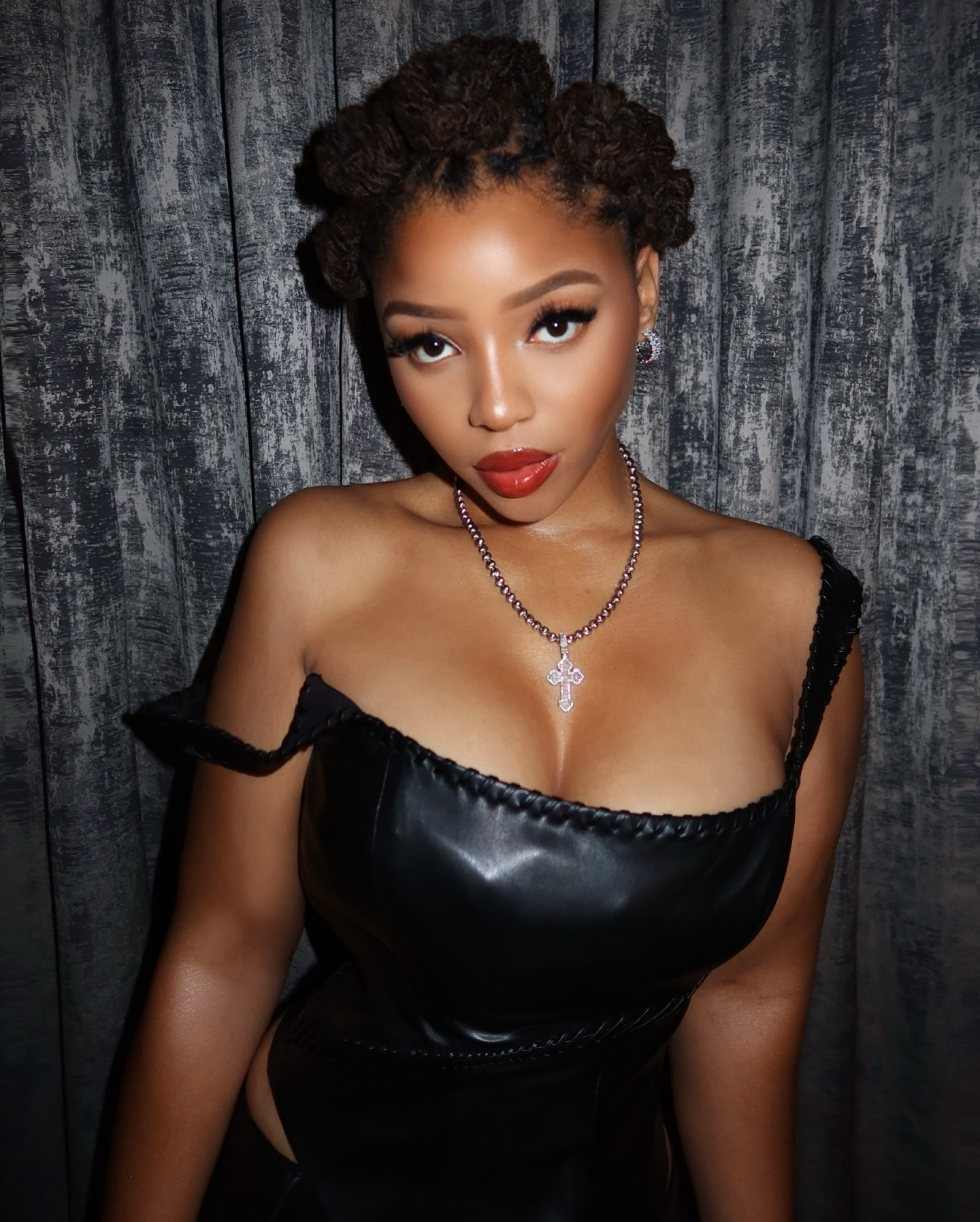 Chloe Bailey Rocks Bold Red Lip & Bantu Knots Look Chloe Bailey stuns with red lips and chic bantu knots, elevating her style to pure glamour