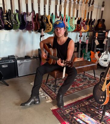 Music star Christian Lopez captures an indoor sunny day moment, radiating relaxed style!!
