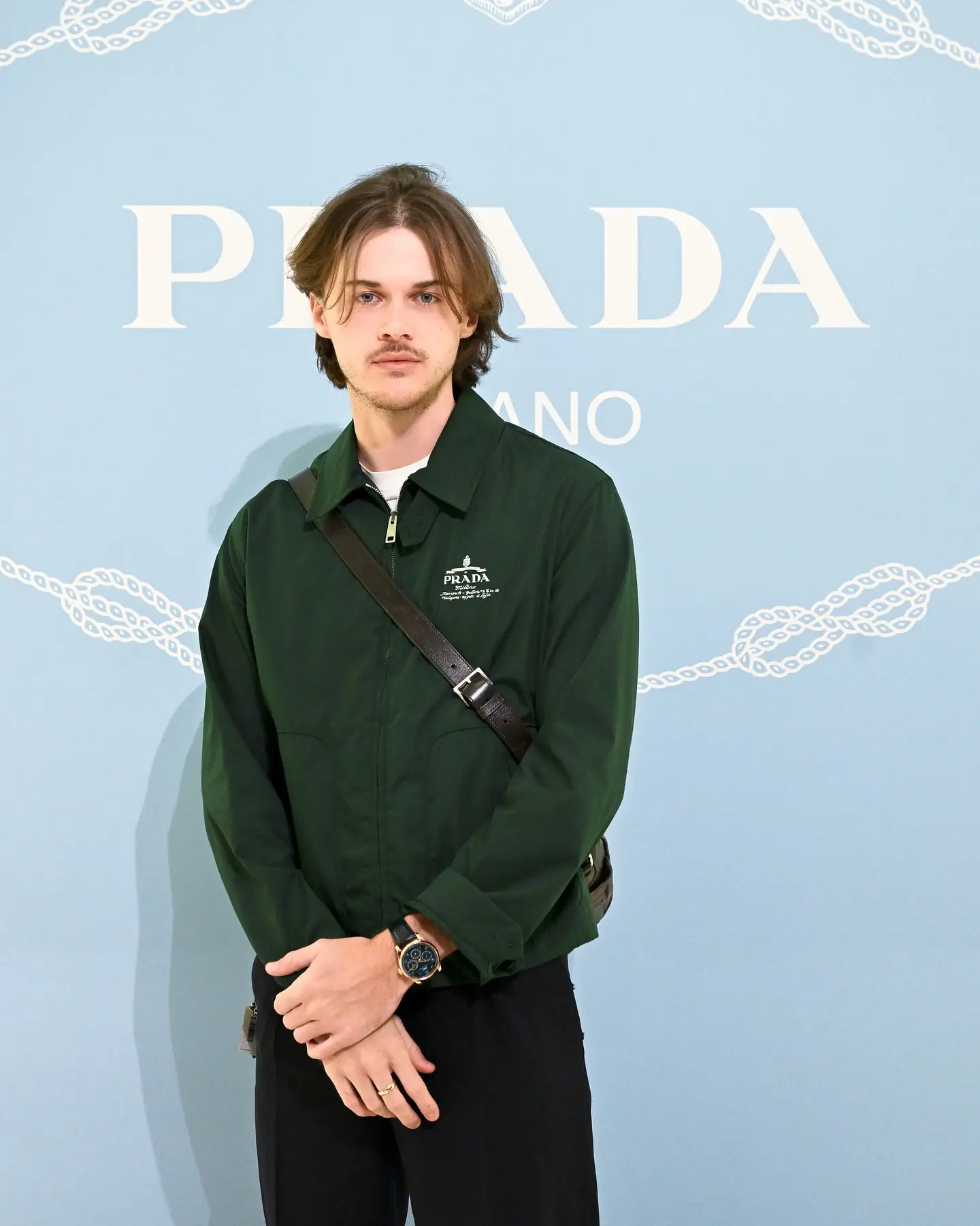 Christopher Briney showcases chic moments and exclusive Prada collaborations for his fans.