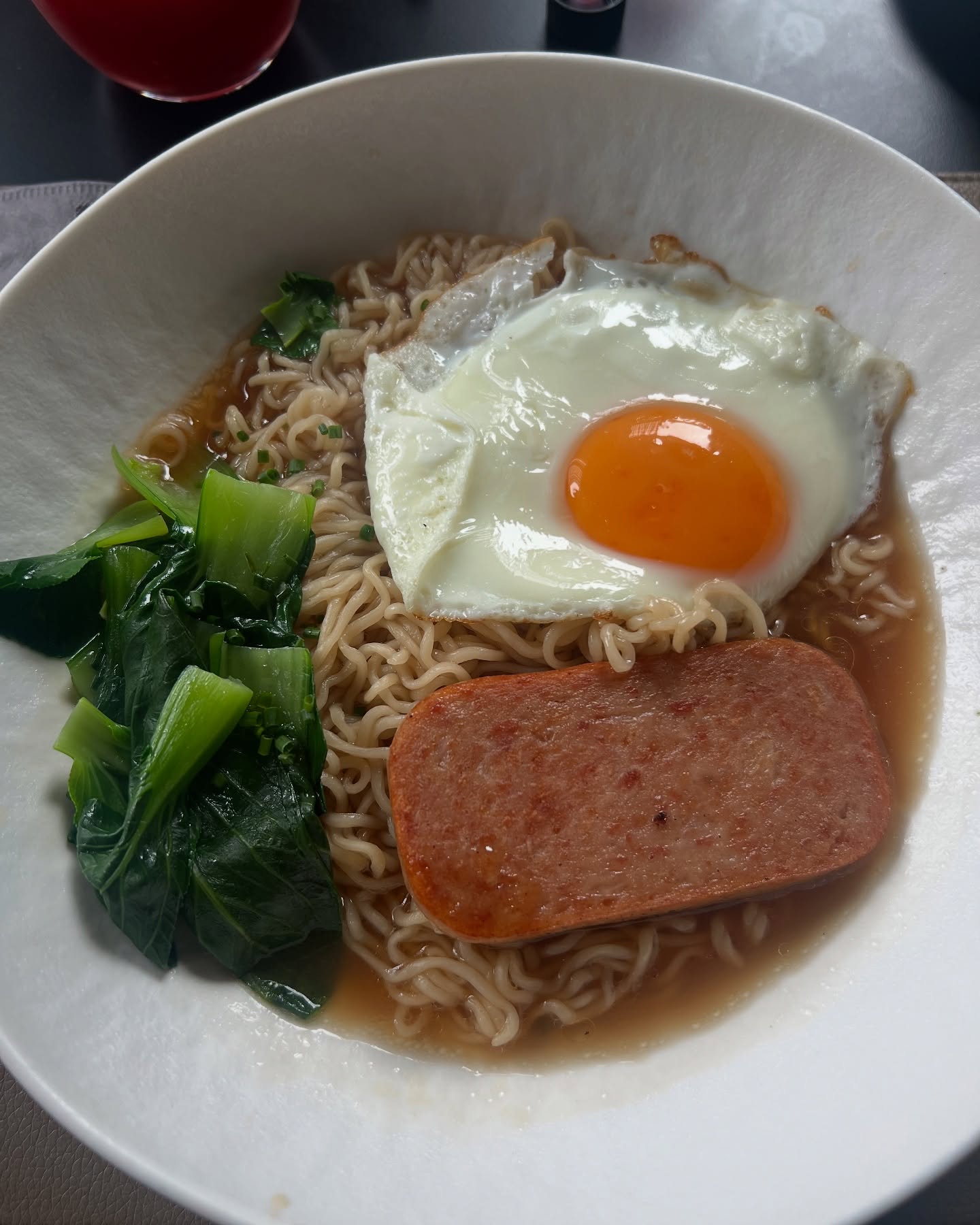 Daniel Wu Enjoys Hong Kong Comfort Breakfast Hong Kong comfort food moment as actor Daniel Wu relishes Spam, egg, and noodle breakfast.
