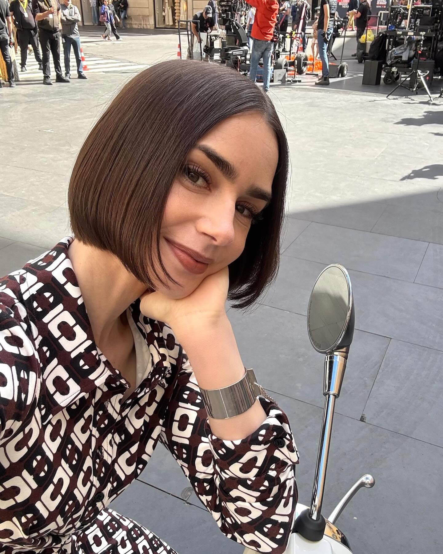 Underway at City of Lights with vibrant scenes as Lily Collins dazzles with renewed magic!