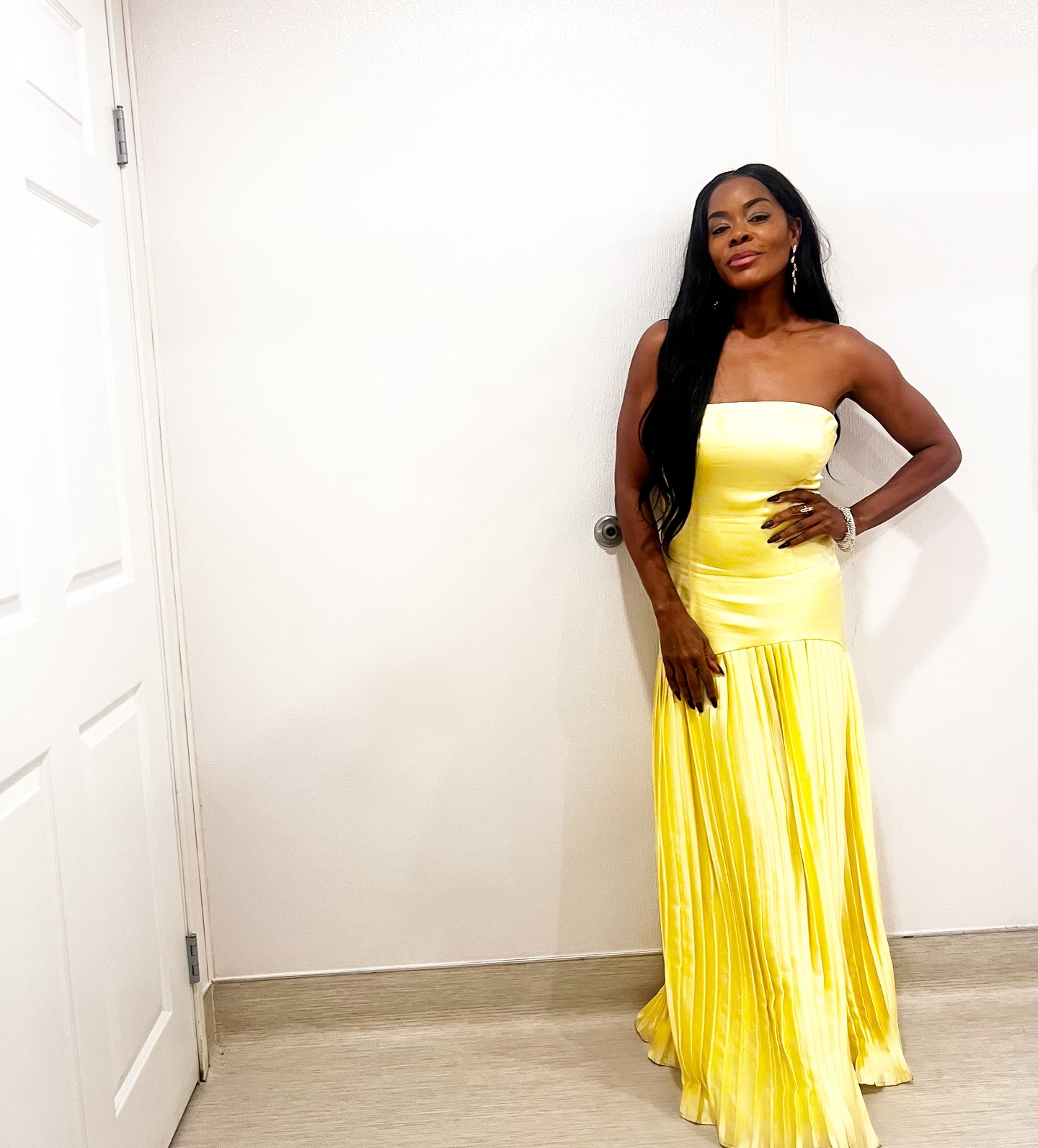 Golden Brooks Shines In Yellow At Wedding Celebration