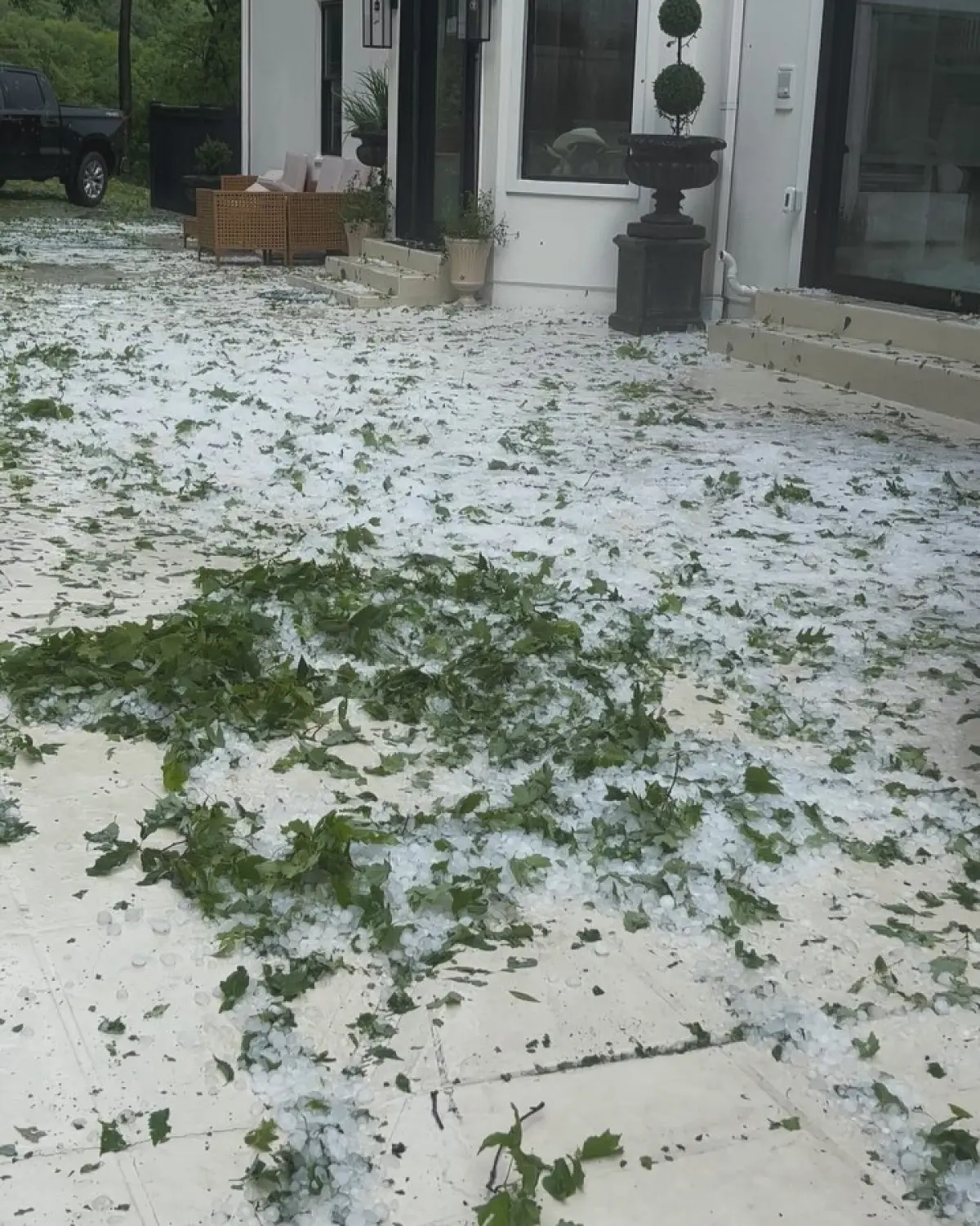 Singer confronts a wild hail storm—ice in his beard and a quirky call for cleanup!!