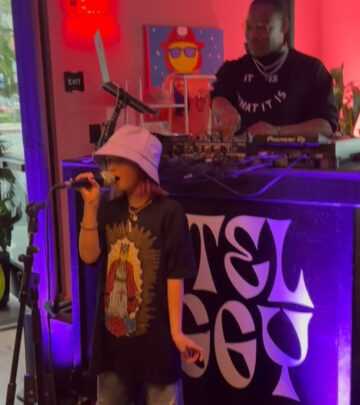 Unexpected talent on stage wows crowd as Isabella amazes fans at Pizza Girl. - Epic Vibes!