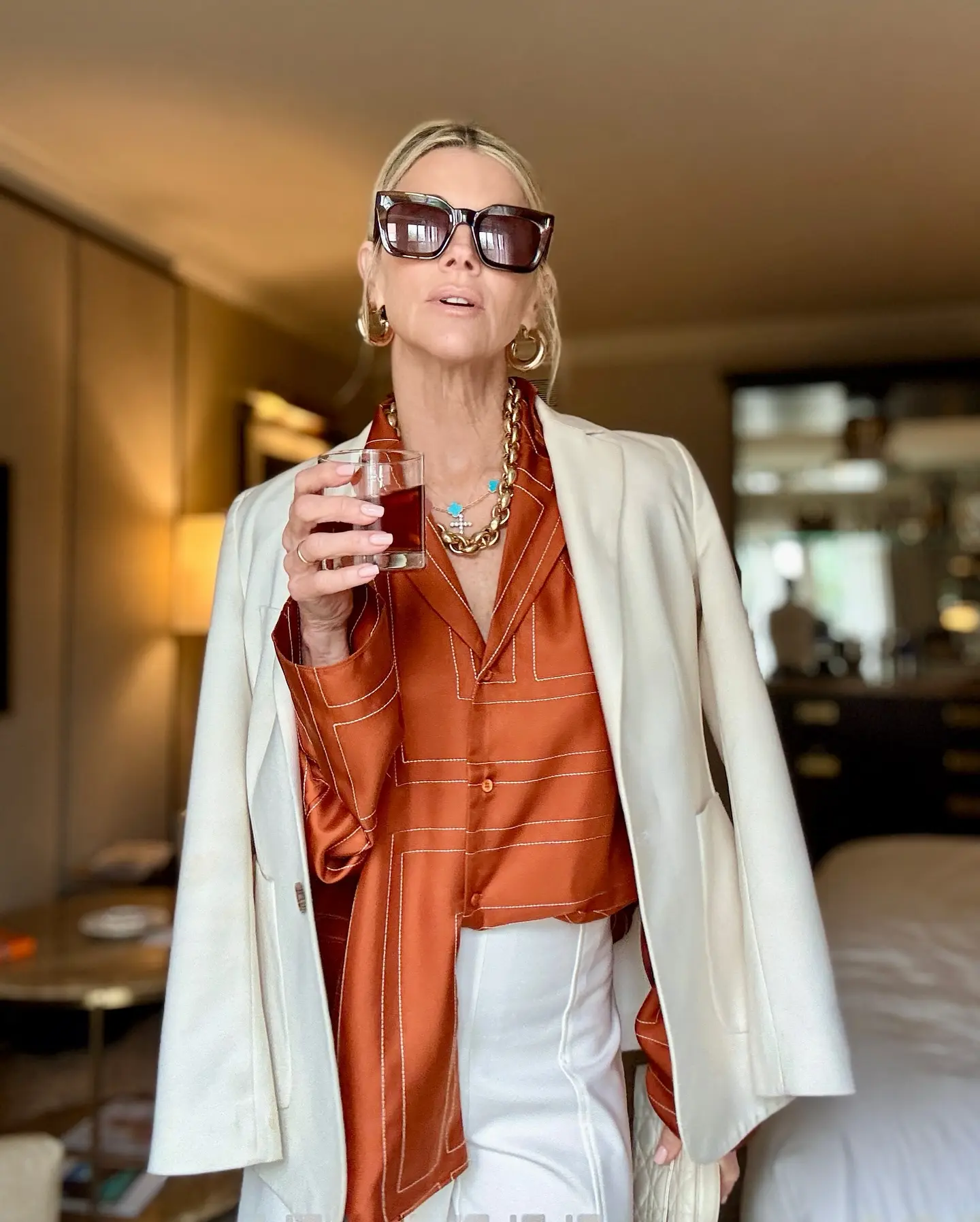 Janet Gunn Embraces Chic Shade On Semi-Sunny Day