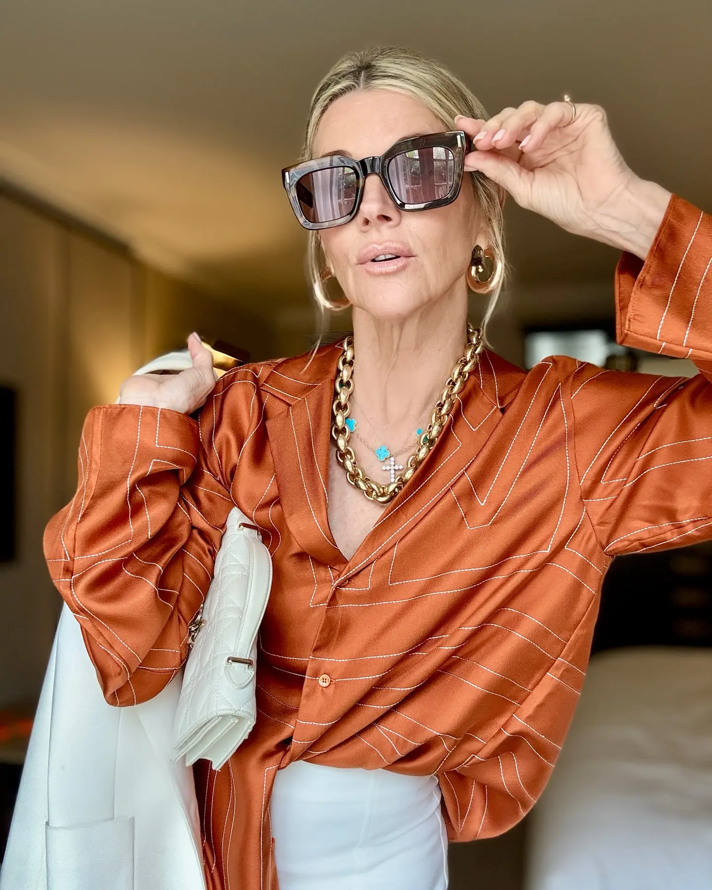 Janet Gunn Embraces Chic Shade On Semi-Sunny Day