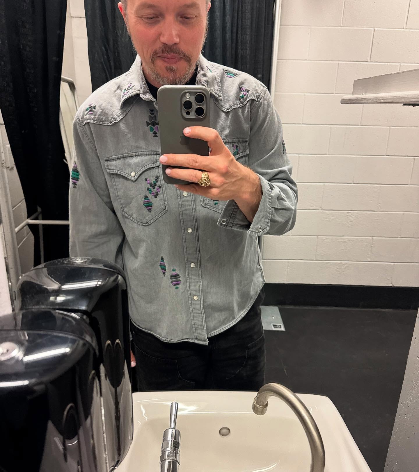 Jason Isbell Enjoys Casual Moments With People And Snacks Jason Isbell savors moments with friends, snacks, and genuine smiles at downtime - true!!!