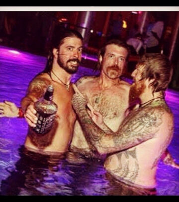 Blast from awards night shows the Eagles of Death Metal leader posing beside rock royalty.