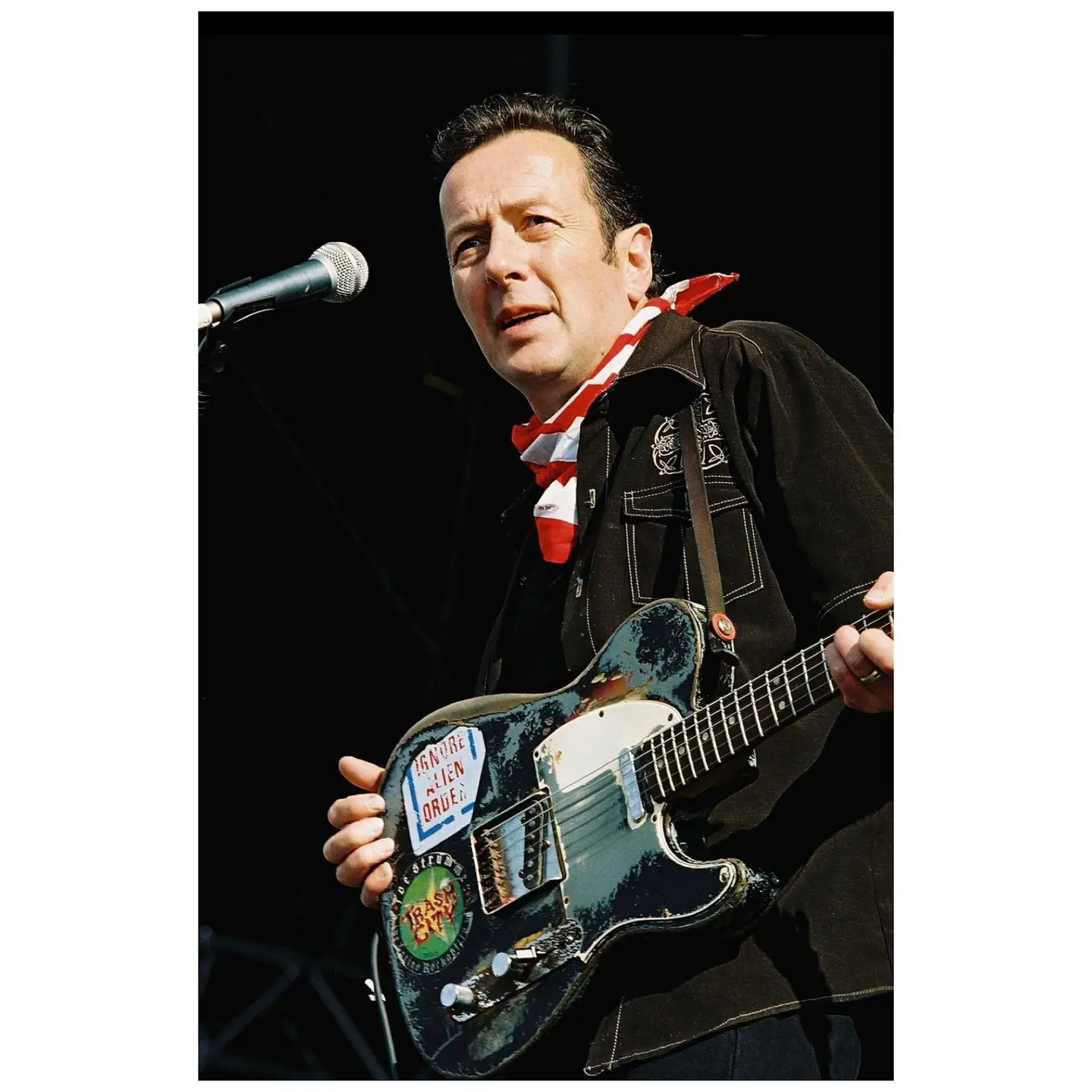 Joe Strummer Mescaleros Ignite Manchester Move Fest Rediscover punk pioneer’s July 2002 set, channeling Clash roots into fresh rebel anthems!!
