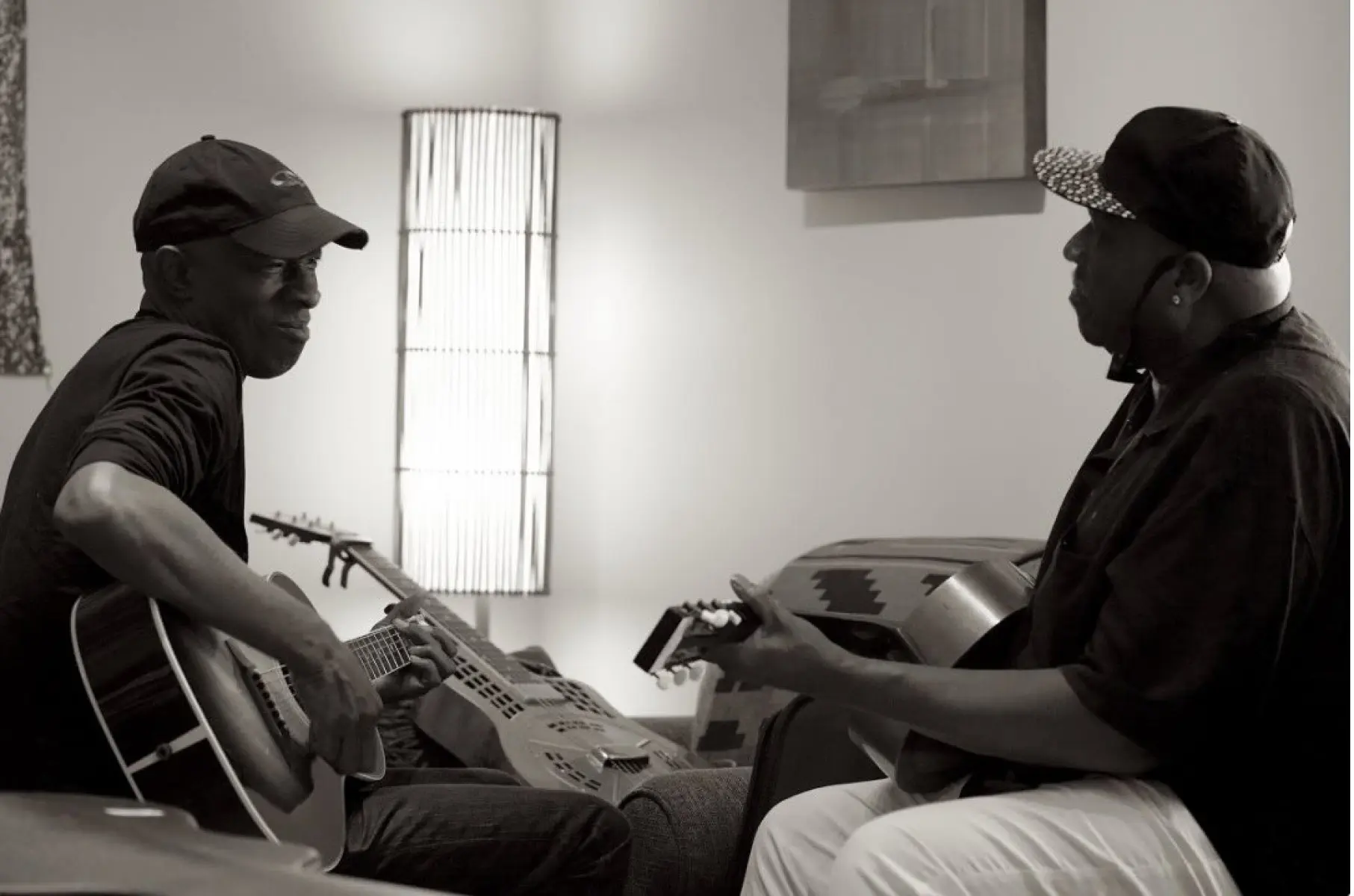 Keb' Mo' returns to his roots, celebrating raw blues power and heartfelt origin with soul.