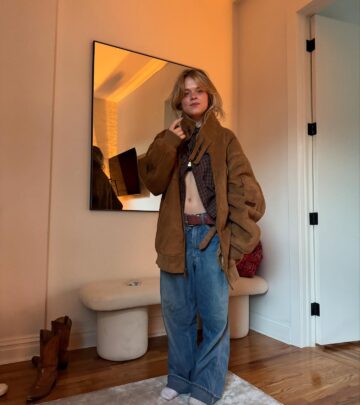 Her casual look includes retro denim pieces, statement chains, and unexpected color pops!!