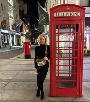 Roma Downey turns heads in Mayfair as iconic telephone boxes meet chic modern London vibes.