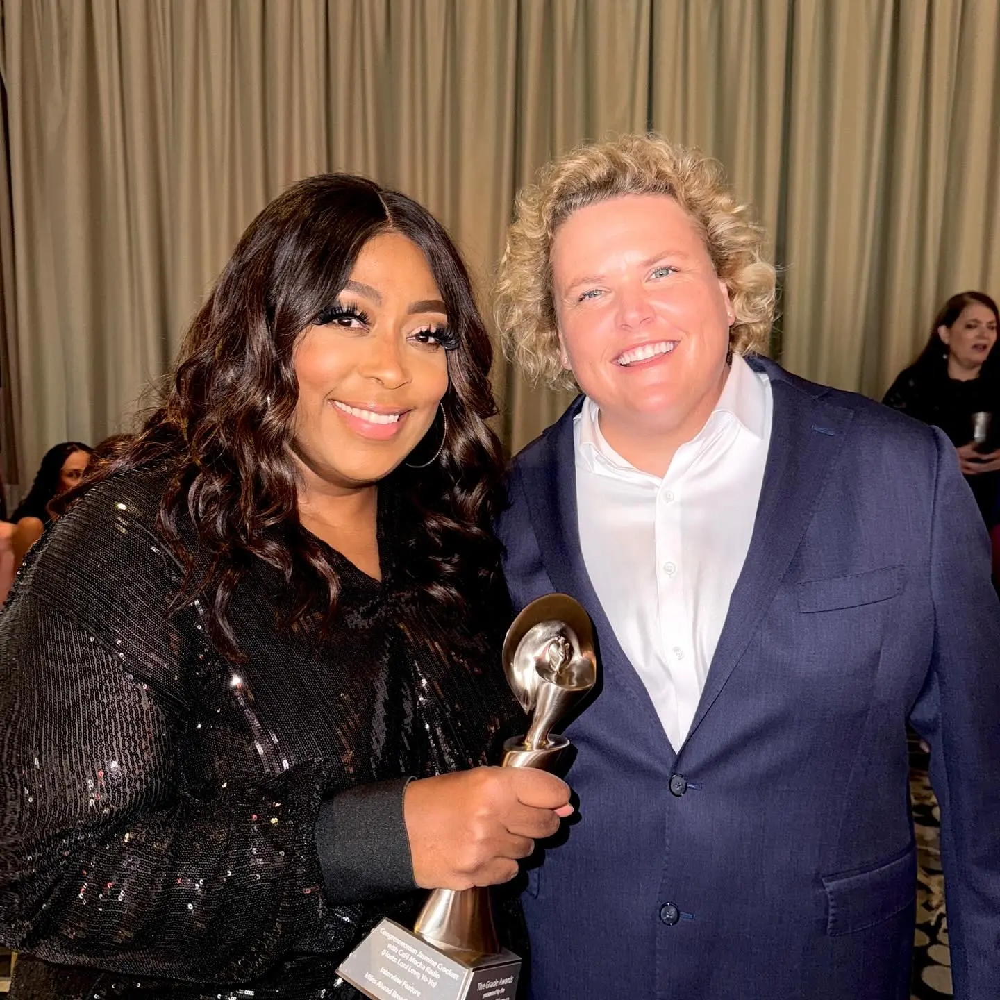 Loni Love At Gracies Awards Celebrates Women In Media Host honors female industry leaders, applauding Jasmine Forus’s interview during the gala.