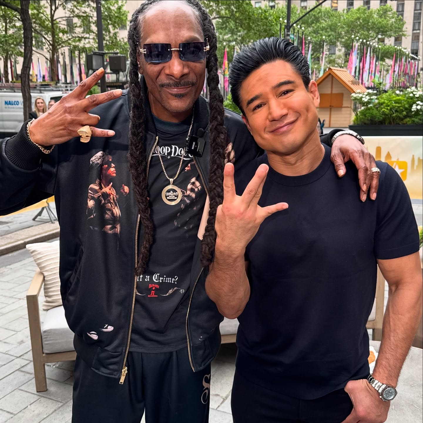 Mario Lopez mixes NYC energy with West Coast swagger alongside Snoop Dogg on set now right.