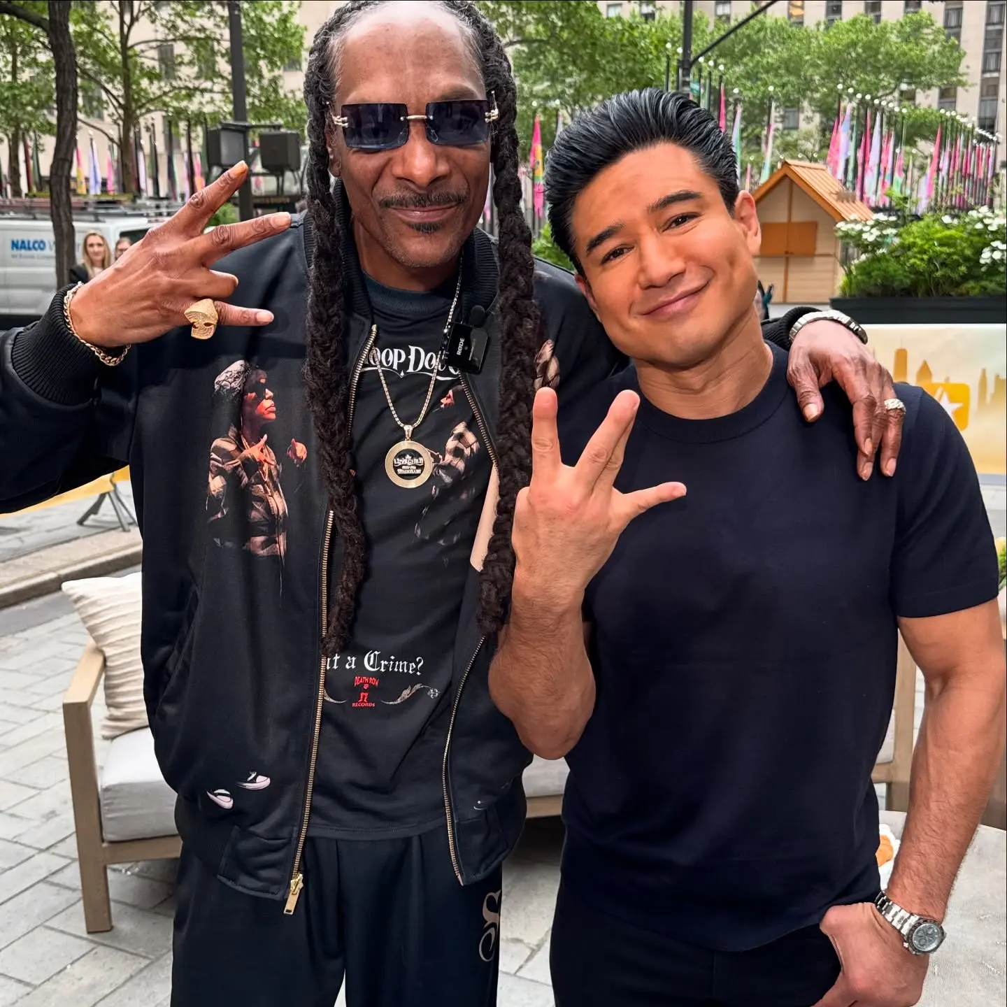 Mario Lopez mixes NYC energy with West Coast swagger alongside Snoop Dogg on set now right.