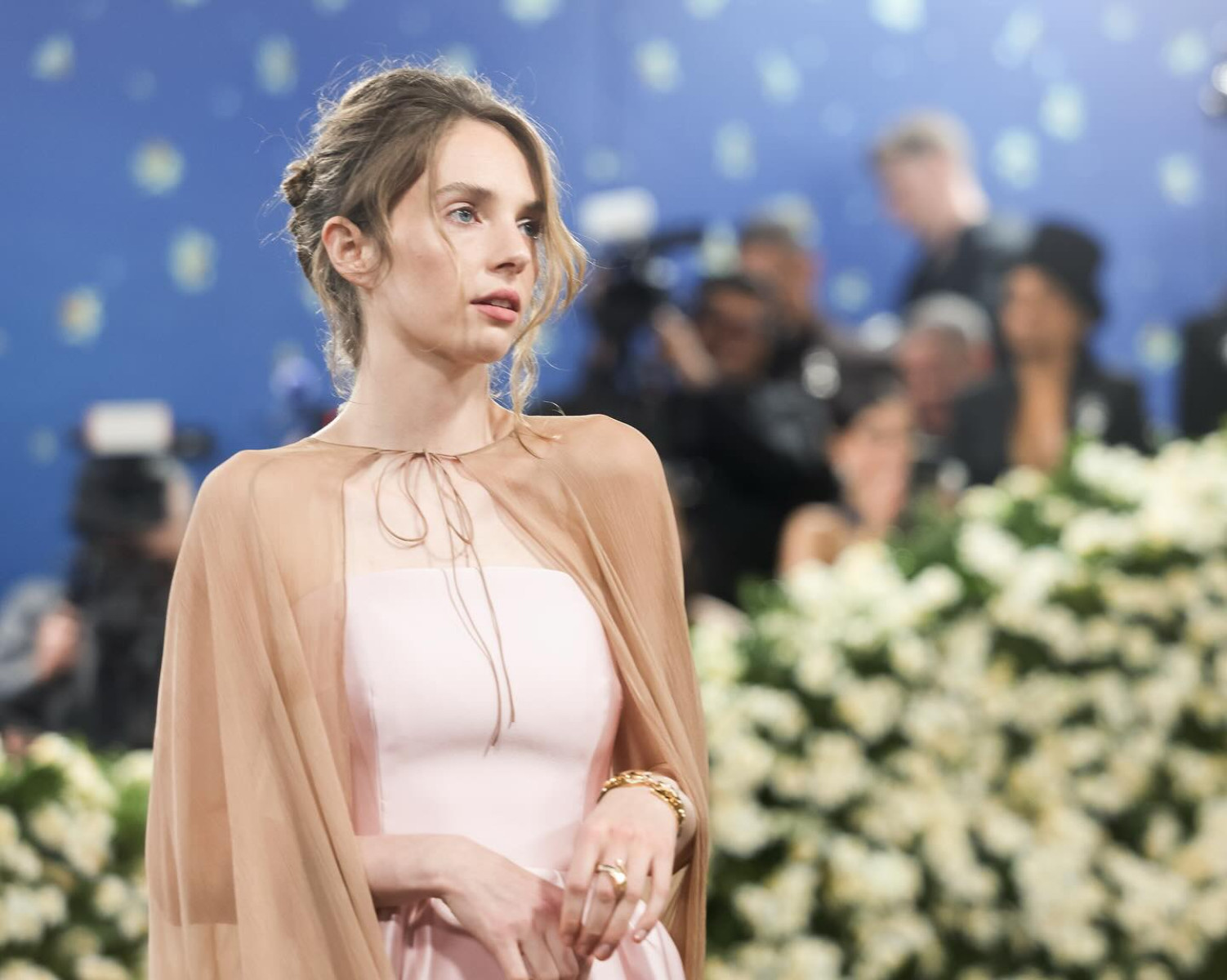 Maya Hawke Shines At The MET Gala In Prada’s Whimsical Dress Maya Hawke stuns at glamorous MET Gala night with high fashion couture charm.