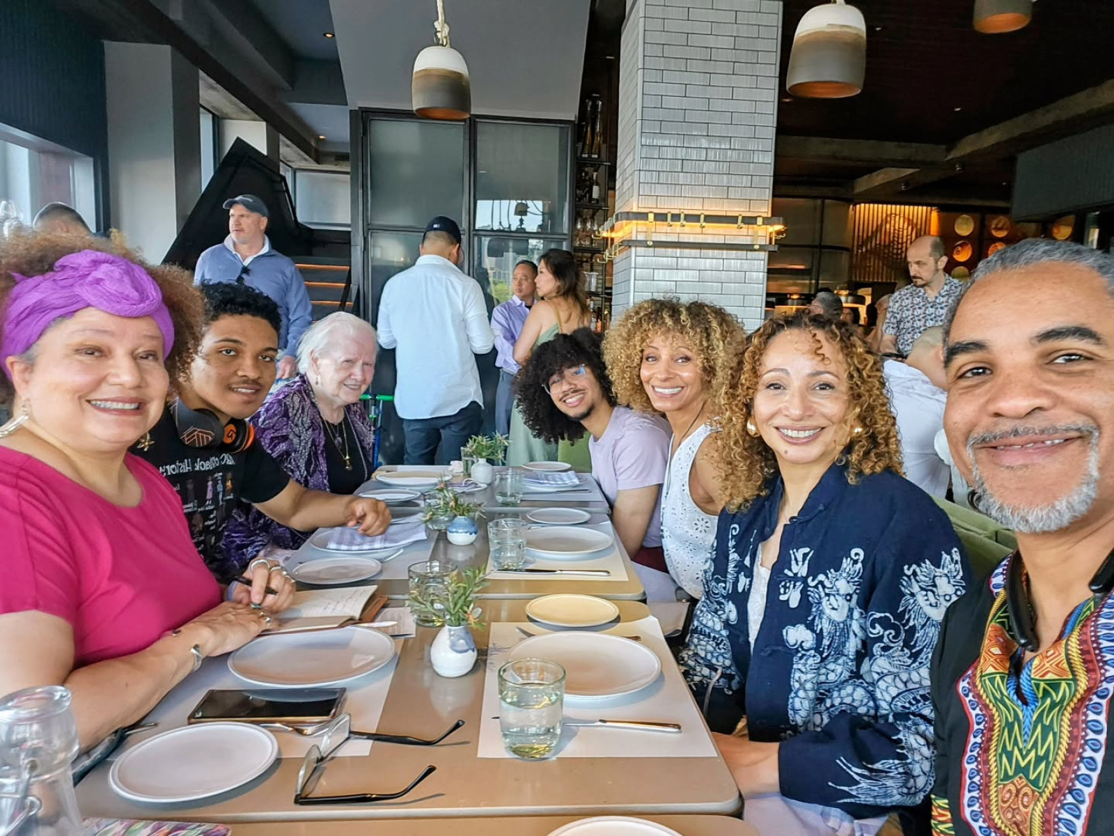 Renowned actress Michelle Hurd embraces her dear kin in a warm, heartfelt familial tribute.