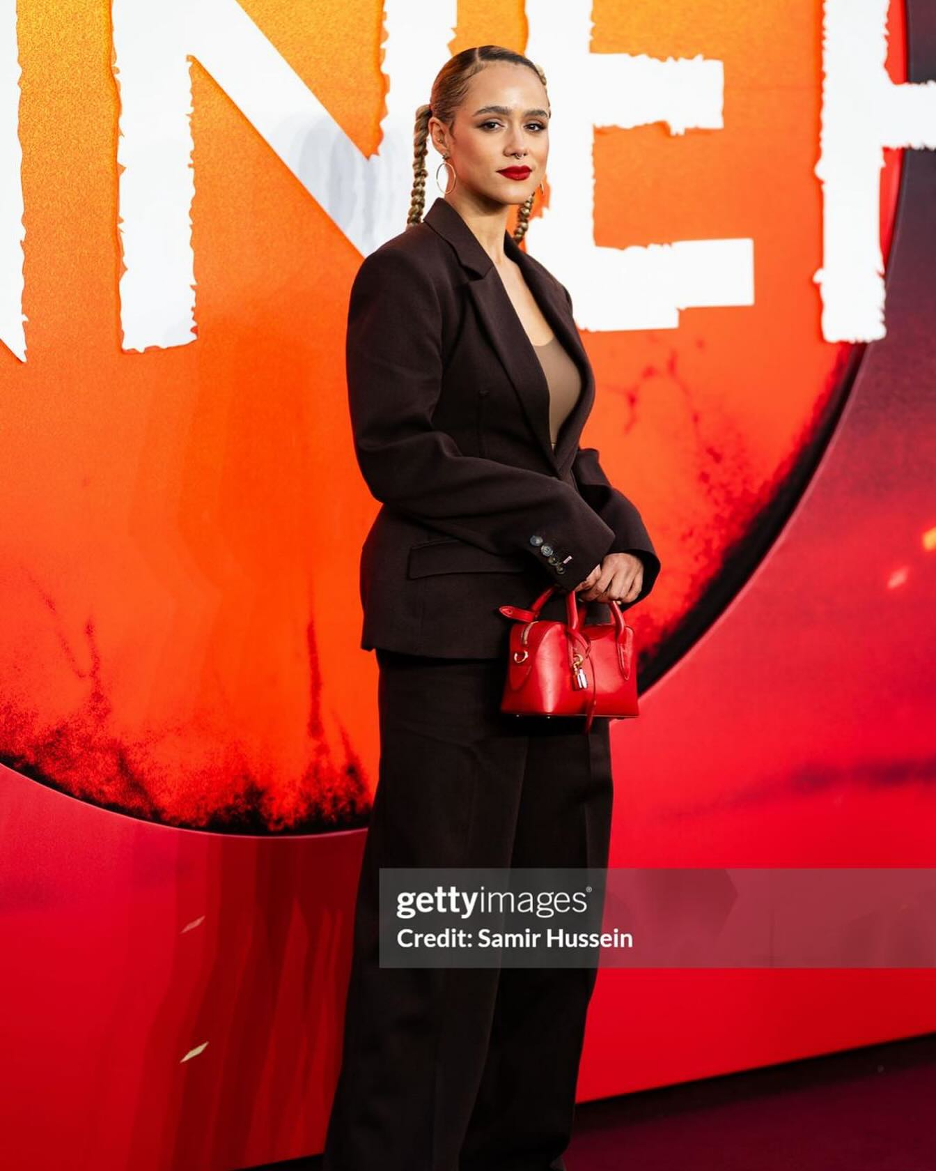 Renowned actor Nathalie Emmanuel beams with joy and style as she revels in film brilliance