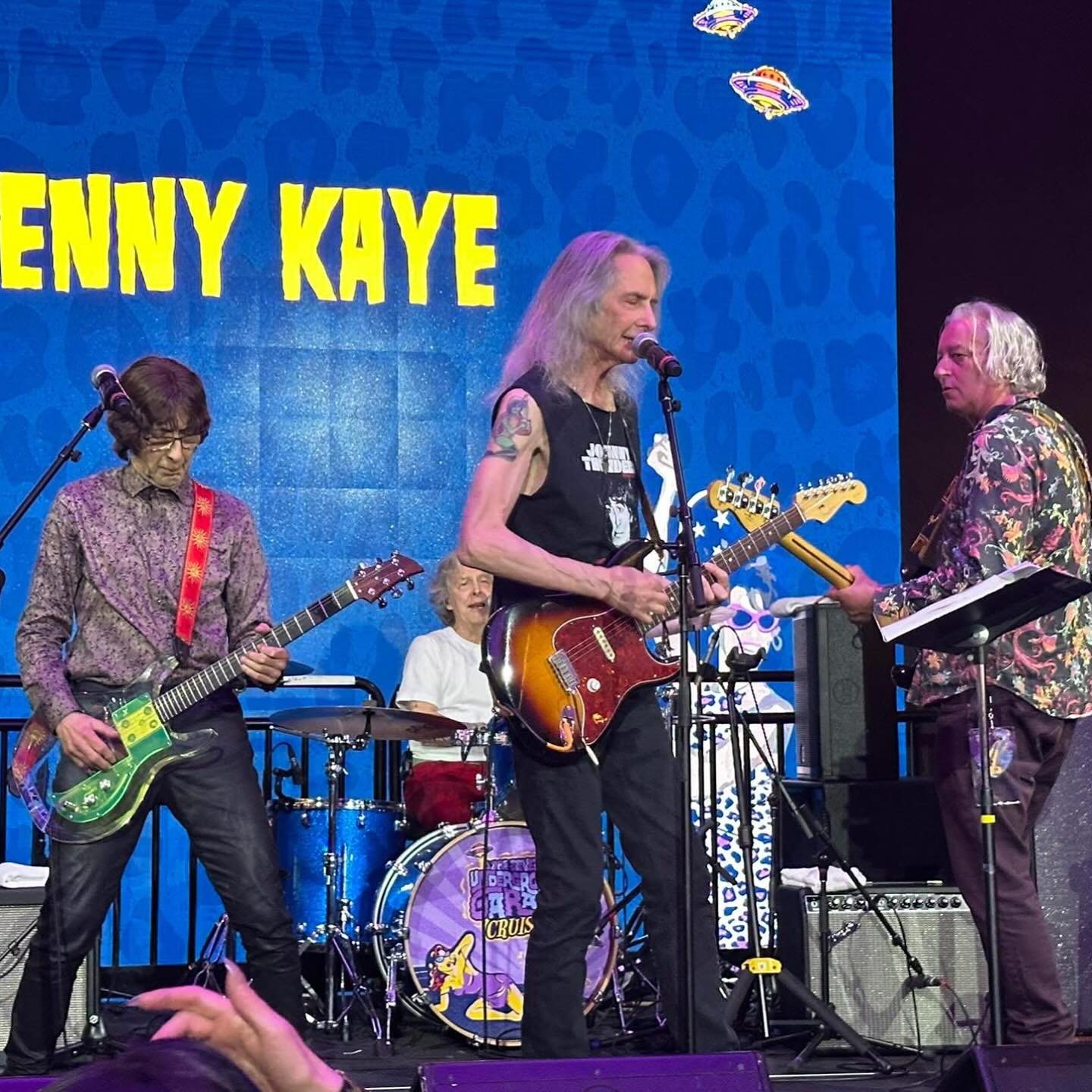 Rock Legends Cruise: Blazing Jam Session at Sea Aboard a cruise ship, guitar riffs and drum beats ignite a legendary rockn’ roll adventure.