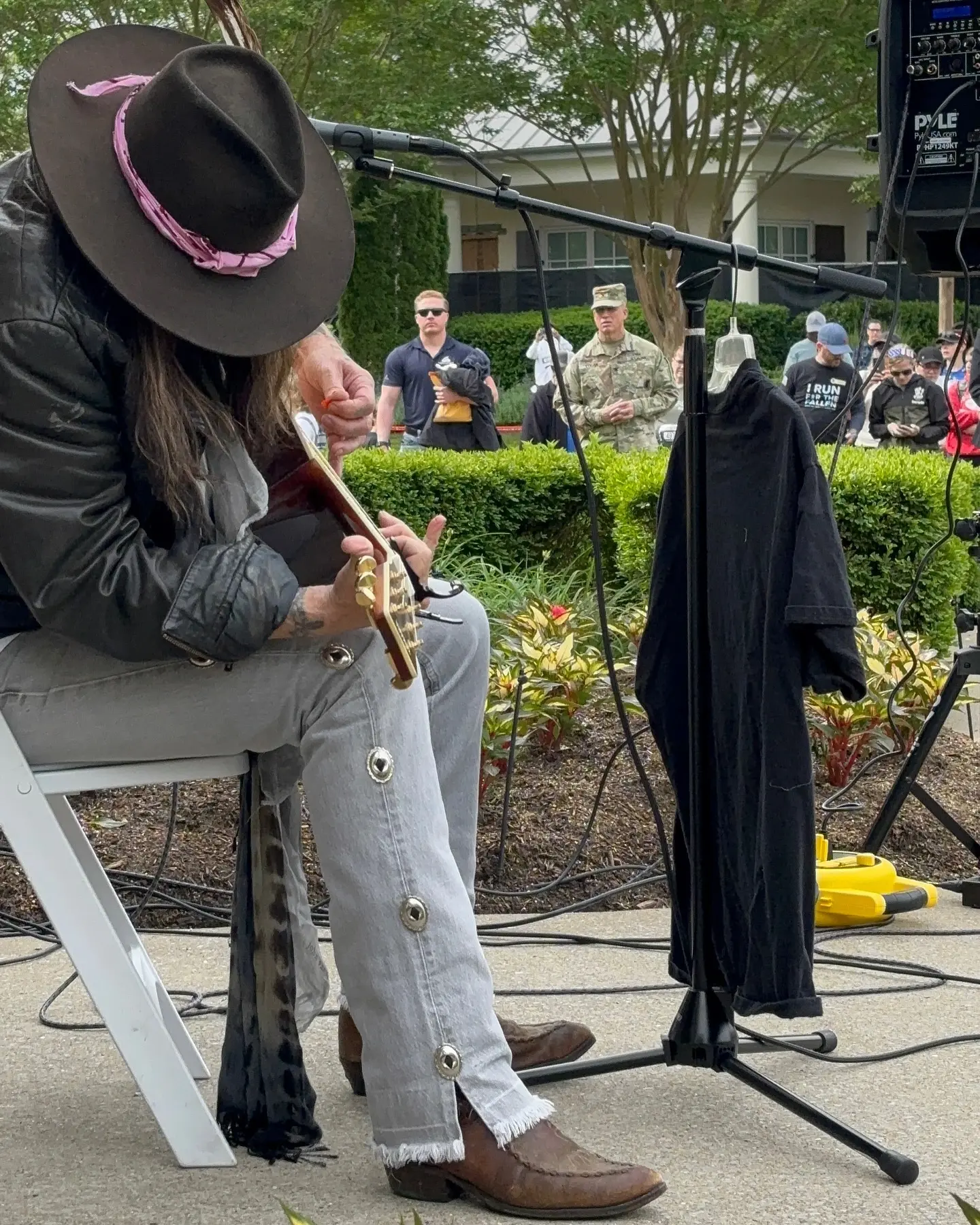 A heartfelt memorial moment during Some Gave All, filled with song, silence, and reflection.