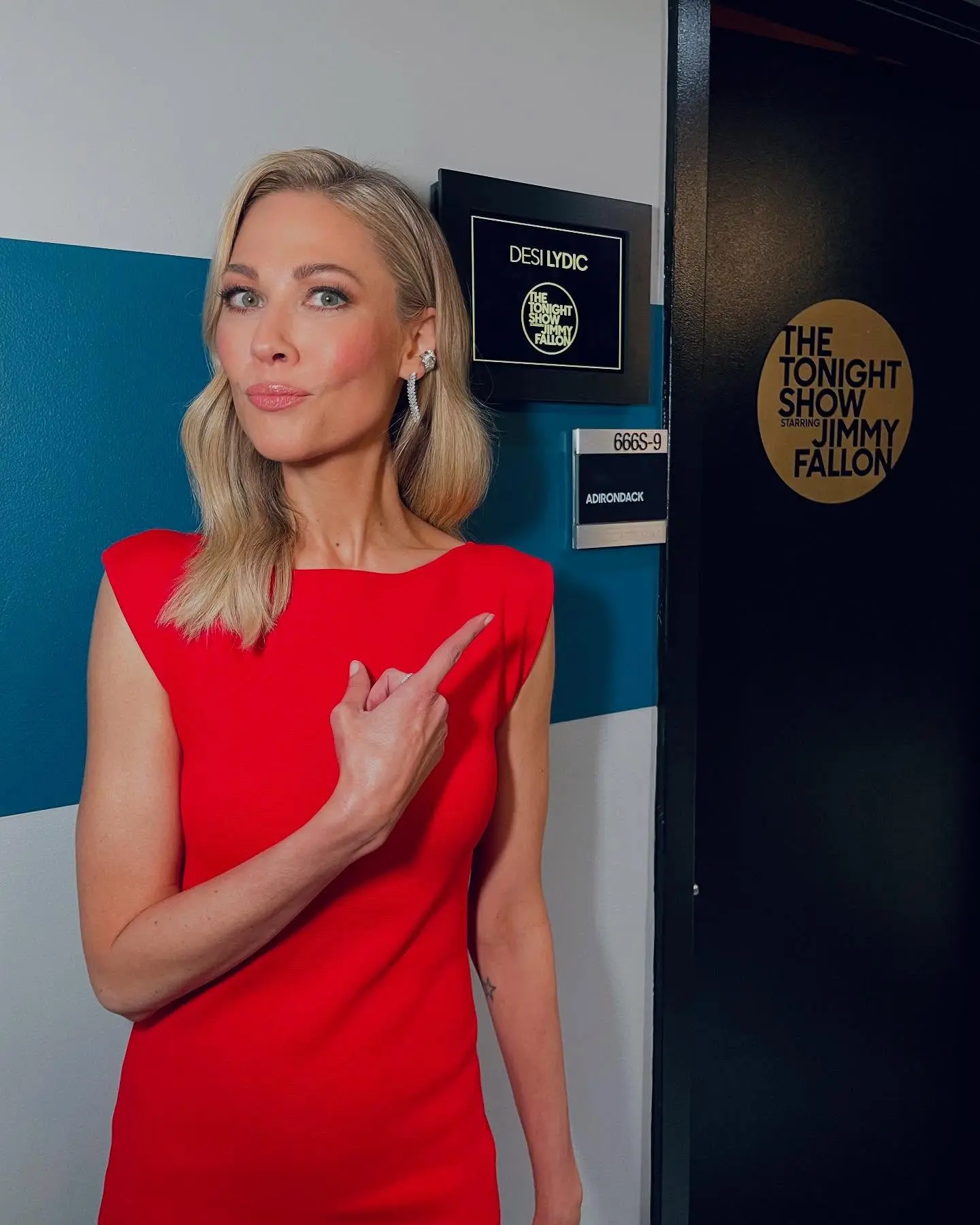 Desi Lydic captivates audiences with a playful seat-flipping display on Fallon's stage.!!?