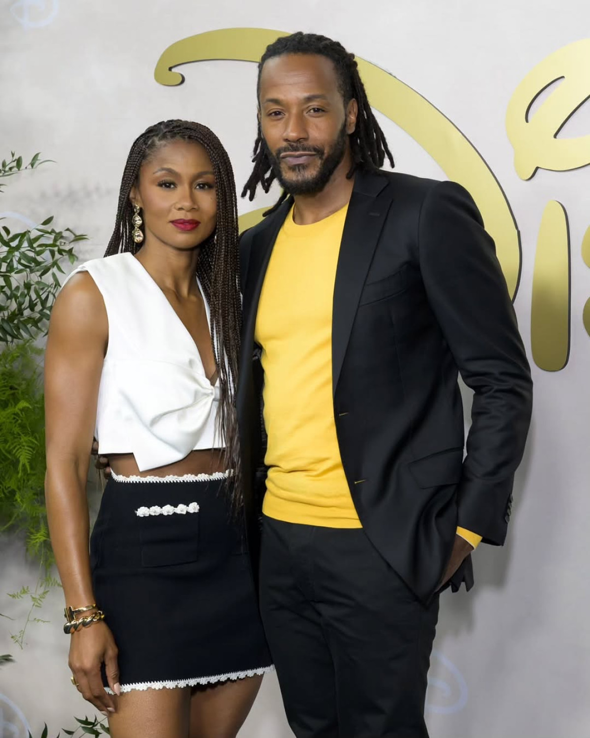Corinealdi and Freeman dazzle on red at Disney Upfronts, exuding a stylish, chic vibe now!