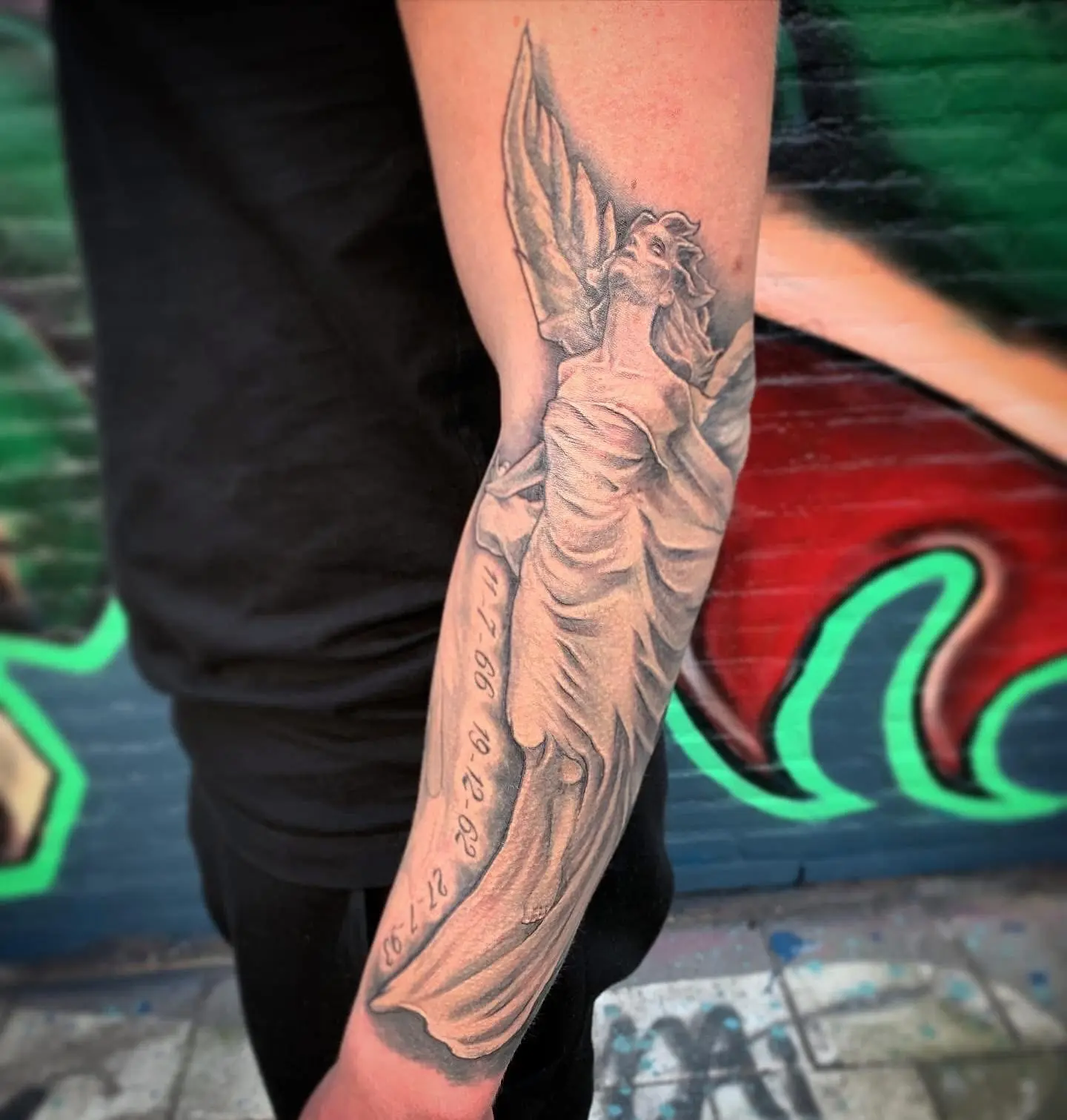 Stunning Arm Tattoo Gallery Of Masterful Imagery A Bold Arm Gallery Merging Black Roses, Angel Wings & Silent Mastery of Ink in Fine Detail
