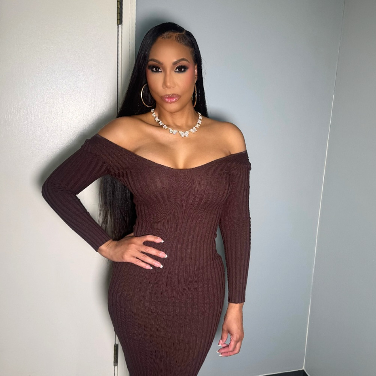 Tamar Braxton Stuns In FashionNova Style Dazzling outfit exudes urban elegance, merging vintage appeal with contemporary chic style.
