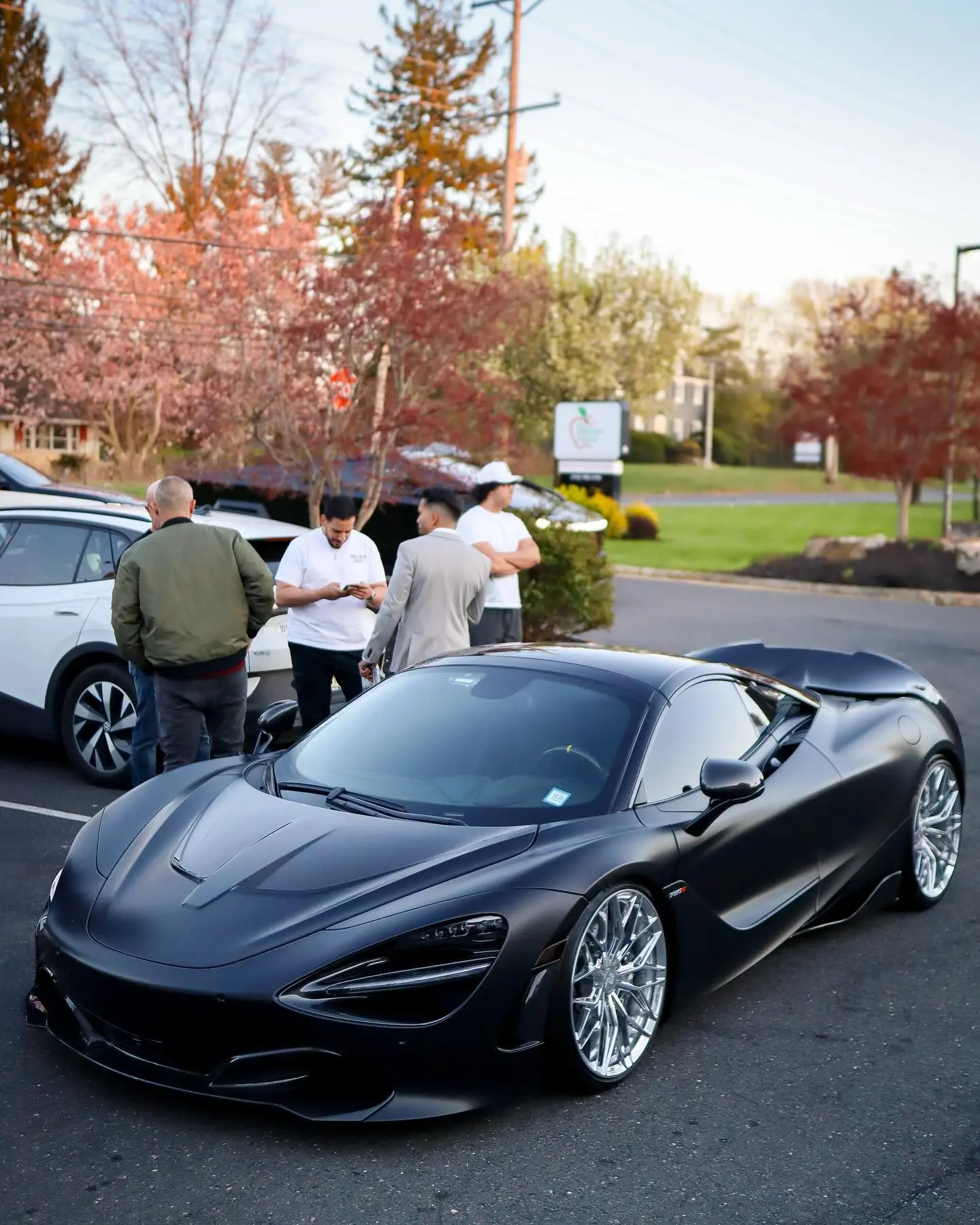TeamSpeedDemon Unveils McLaren 720S Hypercar Influencer shows Batman-inspired shot of a sleek hypercar tagged with GTR_Gil/TaxKingNJ!.