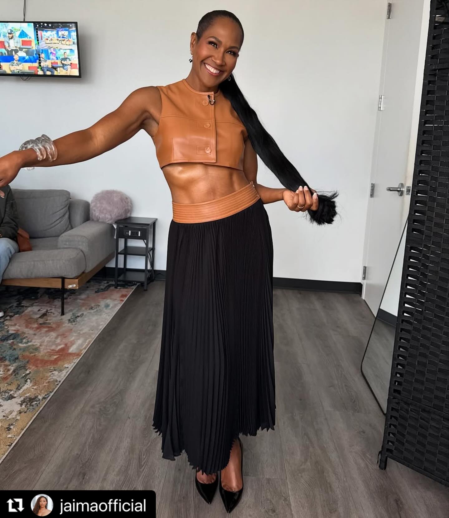 Terri J. Vaughn dazzles in Atlanta with bold style and chiseled abs. 