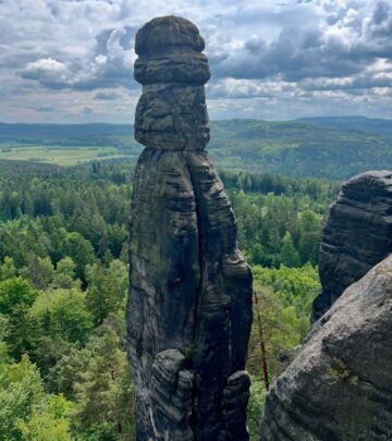 Tom Wlaschiha enjoys the serene allure of Saxon Switzerland on his wander day amid trees.!