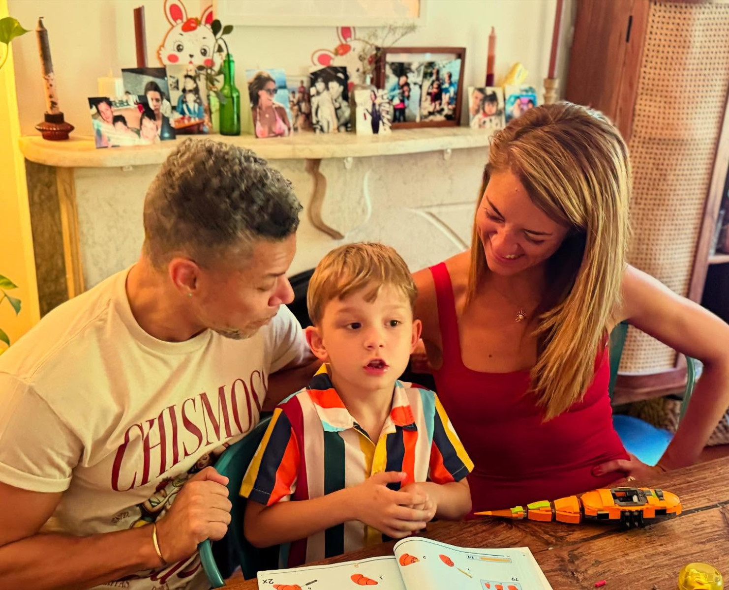 Wilson Cruz Charms With Family Bond On Instagram A tender scene emerges as cherished kin capture every uttered syllable with rapt attention