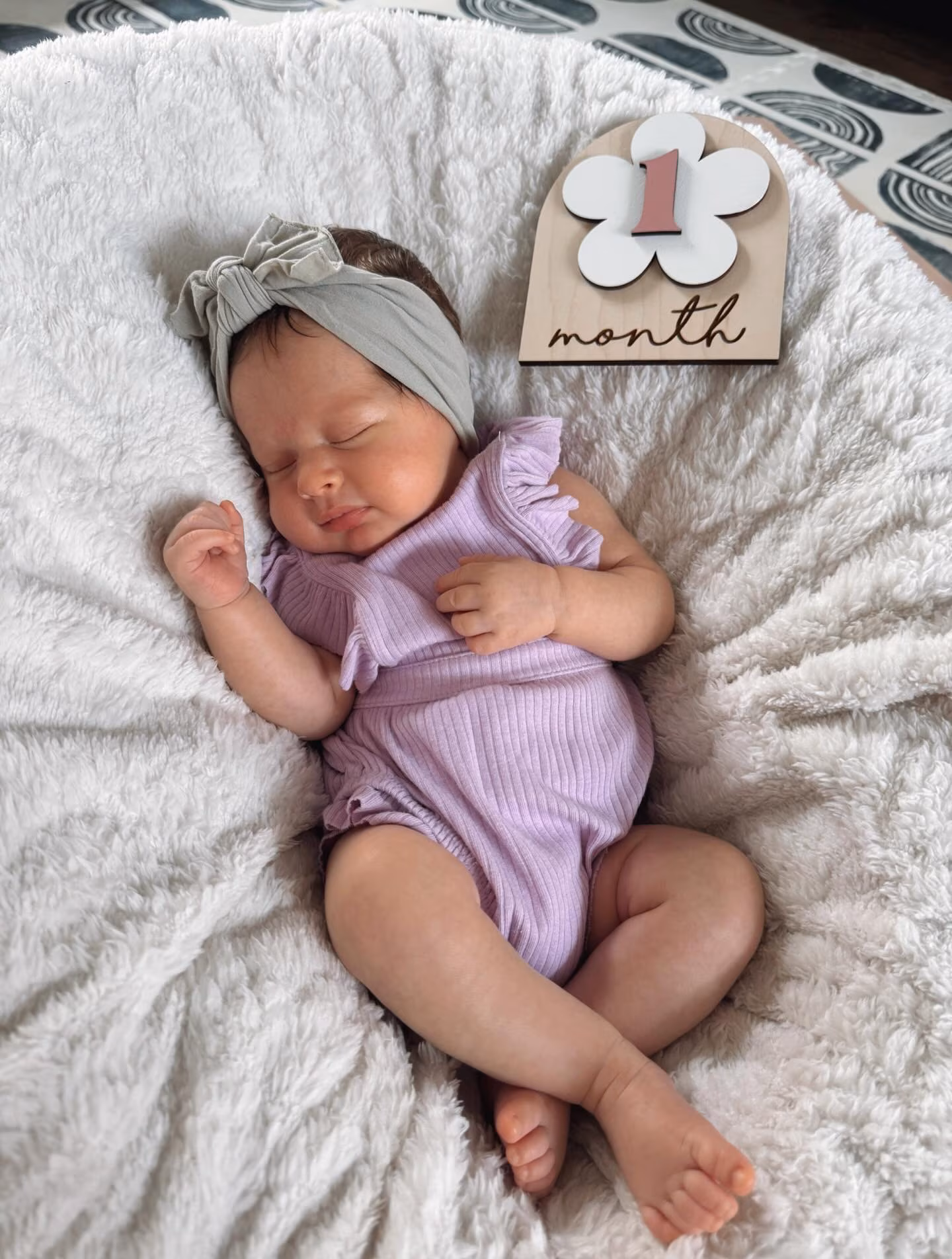 Parents share sweet purple-themed portrait marking little one’s first milestone with touching thanks